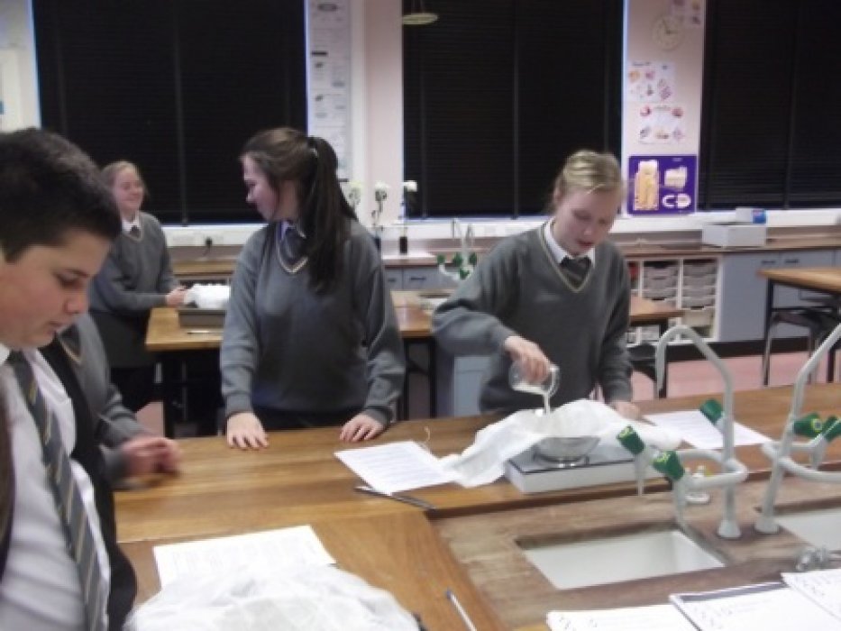 Emptying the curds & whey into cheesecloth