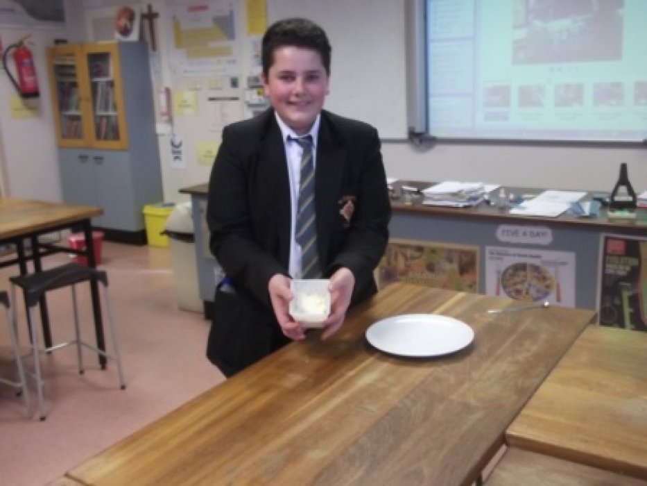 Putting cheese into moulds