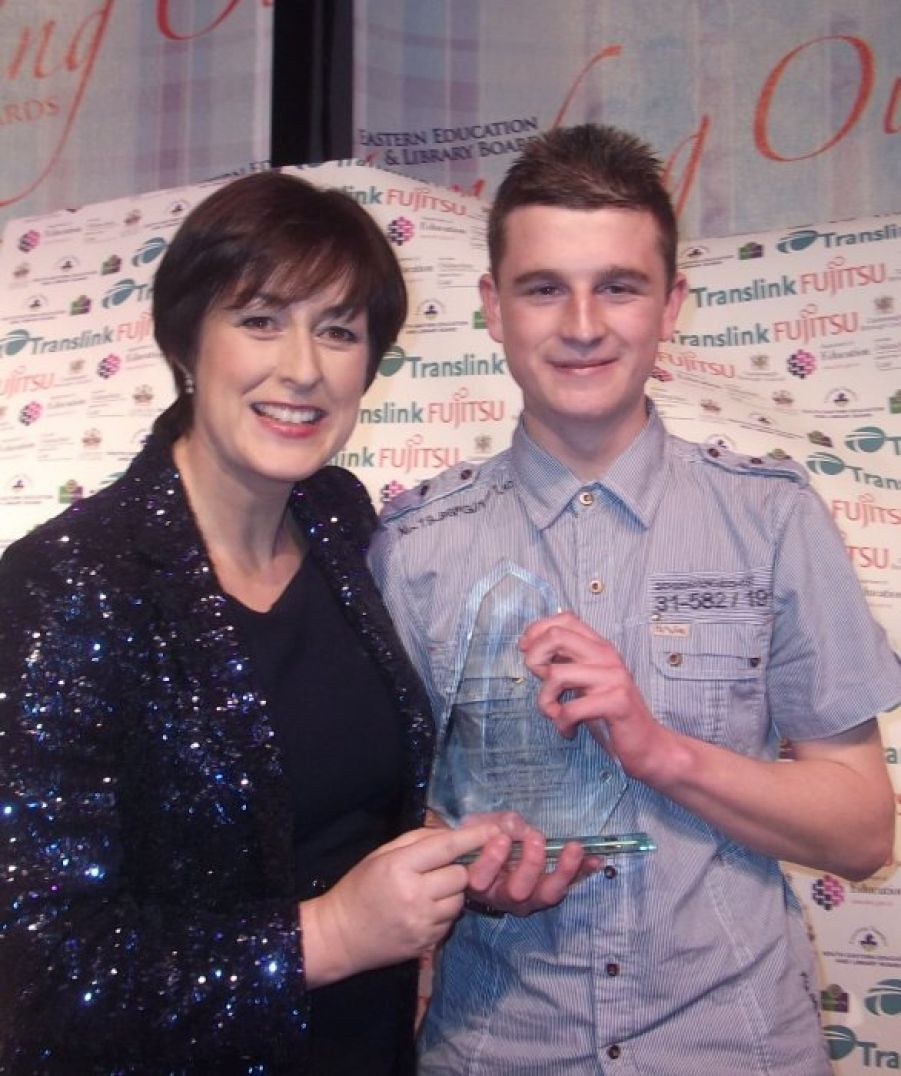 Donna Traynor presenting Christopher Smyth with his Outstanding Achievement Award
